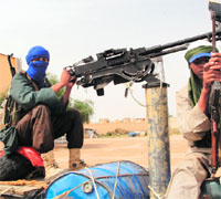 MUJAOs Islamist fighters man a position near Gao airport in Mali.