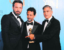Actor-director Ben Affleck (L) and producers Grant Heslov (C) and George Clooney with the award for best motion picture drama for Argo at the Golden Globes awards ceremony in Beverly Hills on Sunday.