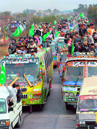 Supporters of Tahir-ul Qadri in Domeli on Monday.