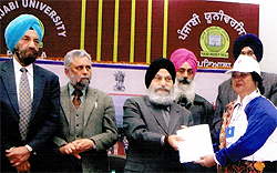 Usha Sharma of the SSD Girls College, recieves an award from Dr Jaspal Singh, Vice-Chancellor, Punjabi University, Patiala, during an event organised to felicitate the outstanding NSS coordinators in the state