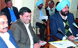 Mayor Baljit Singh Birbehman (in blue turban) and Municipal Commissioner Uma Shankar Gupta listen as Jagroop Singh Gill of the Congress makes his point at the general house meeting of the Municipal Corporation Bathinda on Tuesday