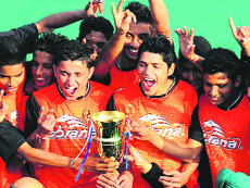 Chandigarh hockey players in a jubliant mood after winning the trophy at Hockey Stadium, Sector 42, Chandigarh. 