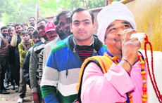 Cricket fans stand in a queue to buy tickets for the 4th One-Day International match between India and England at PCA Stadium in Mohali on Tuesday. 