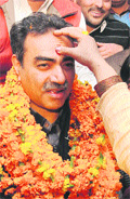 Party workers greet Sanjay Tandon in Chandigarh on Tuesday. 