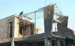 The violation being removed from a house in Sector 9, Chandigarh, on Tuesday. 