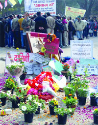 Protestors gather at Jantar Mantar to pay tribute to the gangrape victim after one month of the brutal incident in New Delhi on Tuesday