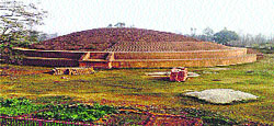 A file photo of the Buddhist stupa at Chenati village in Yamunanagar District shows renovation work being carried out with modern bricks