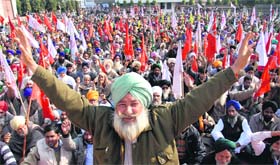 Members of various farmer-labourer organisations hold a protest rally at Desh Bhagat Yadgaar Hall in Jalandhar on Tuesday