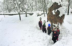 Women carry metal pitchers filled with water in the upper reaches of Shopian district