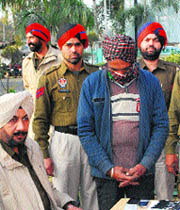 The drug peddler in police custody in Ludhiana on Tuesday. 