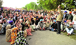 Supporters of former Akali sarpanch Sukhmander Singh at a dharna in Guru Gobind Singh Medical College, Faridkot, on Tuesday