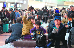 Stranded: Travellers wait for their flights at Tokyo's Haneda airport on Tuesday, a day after heavy snowfall hit the Tokyo metropolitan area. Japanese airlines cancelled more than 460 domestic flights.  AFP