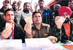 Government Railway Police officials show seized gold jewellery