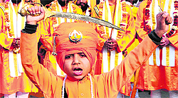 A child leads the nagar kirtan ahead of the birth anniversary of Guru Gobind Singh at Amritsar on Wednesday