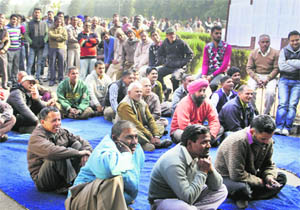 The non-teaching staff stage a protest at Panjab University in Chandigarh on Wednesday. 