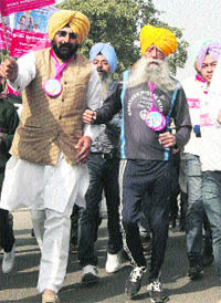 Marathon runner Fauja Singh takes part in a run at Mohali on Wednesday. 