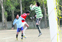 Players in action in a match in the Neel Rattan Memorial Football Tournament played at Parade Ground in Dehradun on Wednesday. Tribune photo: Vinod Pundir