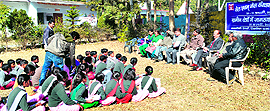 Officials of the ONGC during an awareness programme on oil conservation at a school in Vikasnagar on Wednesday
