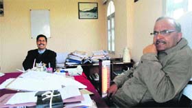 Executive Engineers GK Jhamb and Vijay Kumar in the office of the Executive Engineer, PWD, Kangra Division