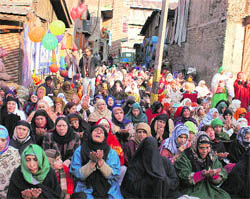 Women offer special prayers at the shrine of Sufi saint Naqashband Sahib in Srinagar on Wednesday. 