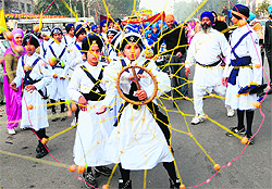 Sikh boys perform gatka during a religious procession on the eve of the birth anniversary of Guru Gobind Singh in Amritsar on Wednesday