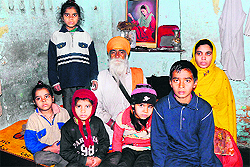 Swaran Singh with his grandchildren at Maqboolpura on Wednesday