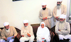 Mata Chand Kaur with Satguru Uday Singh (at her left) briefs media persons in Bhaini Sahib on Wednesday