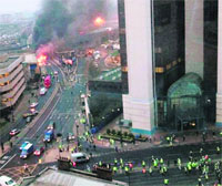 Smoke and flames at the site of a helicopter crash in central London on Wednesday.  AP/PTI