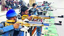 Shooters in action during the inter-university shooting championship at GNDU in Amritsar on Thursday