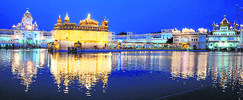 The illuminated Golden Temple complex on the eve of the birth anniversary of Guru Gobind Singh in Amritsar on Thursday