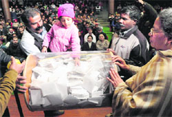 A girl takes out a slip during the draw of lots at St Anne's School in Sector 32, Chandigarh, on Thursday. Tribune photo: Parvesh Chauhan 