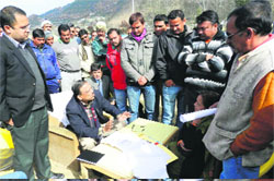 Members of social organisations talk to Principal Secretary, Technical Education, Rakesh Sharma, in Pithoragarh on Thursday. 