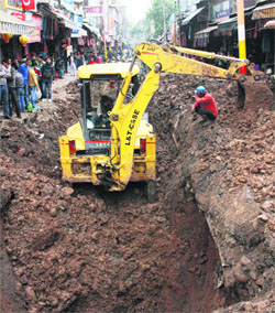Work on a sewerage in progress at Raghunath market in Jammu on Thursday. 