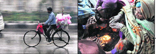 A candyfloss vendor cycles in the rain; and (right) homeless women try to keep themselves warm by sitting around a bonfire in Jammu on Thursday.