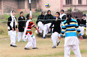 Students of Government Women College play handball in Jammu on Thursday. 