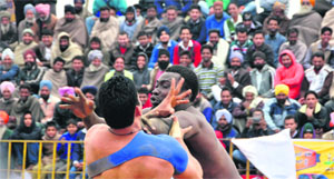 A kabaddi match in progress between Sierra Leone and Kalakh at Jarkhar village, near Ludhiana, on Thursday. 