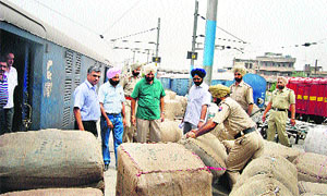 Excise officials confiscate goods from the railway station in Ludhiana. 