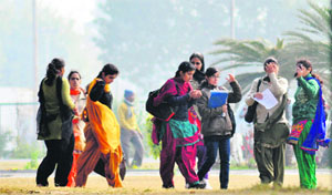 Students brave strong winds on the PAU campus in Ludhiana on Thursday.