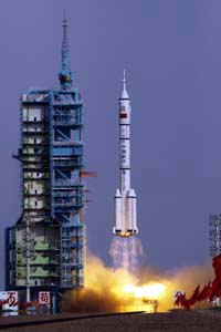 The Long March II-F rocket loaded with a Shenzhou-9 manned spacecraft carrying Chinese astronauts Jing Haipeng, Liu Wang and Liu Yang lifts off from the launch pad in the Jiuquan Satellite Launch Center, Gansu province, in this June 16, 2012, file photo.