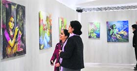 mythical aura: Visitors admire Malay Dattas paintings at Art Portfolio photo: manoj mahajan