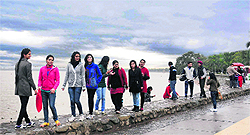 Residents enjoy the cloudy weather at Sukhna Lake in Chandigarh on Friday