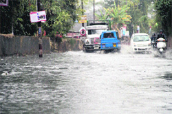 A road flooded with water after incessant rain in Dehradun on Friday. 