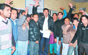 Local residents stage a protest against the poor working of the Municipal Corporation in Haridwar on Friday. 