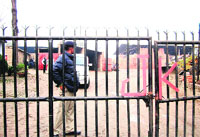 A security personnel on the premises of one of the raided brick kilns in Sundernagar on Thursday. Photo: Mahesh Chander Sharma