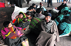 Stranded passengers at a bus stand in Jammu on Friday