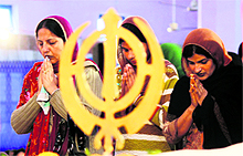 Devotees pay obeisance on Gurpurb at Gurdwara in Jammu on Friday