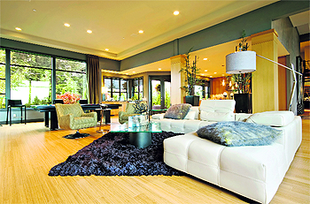 Hardwood flooring, furniture with straight lines and undressed windows add a modernistic aura to the interiors of your home 