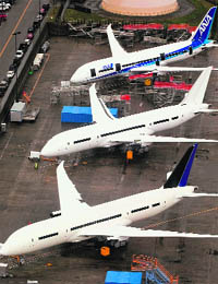 In-production Boeing 787 Dreamliner aircraft for ANA and other airlines sit on the tarmac at the Boeing production facilities at Paine Field in Everett, Wash. The US aerospace giant said it had suspended 787 deliveries but continues to build the plane. 