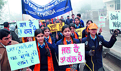 Students take part in a rally organised to raise awareness on conserving water in Bathinda on Saturday
