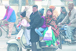 A family clads itself well in woollens before venturing out on a chilly morning